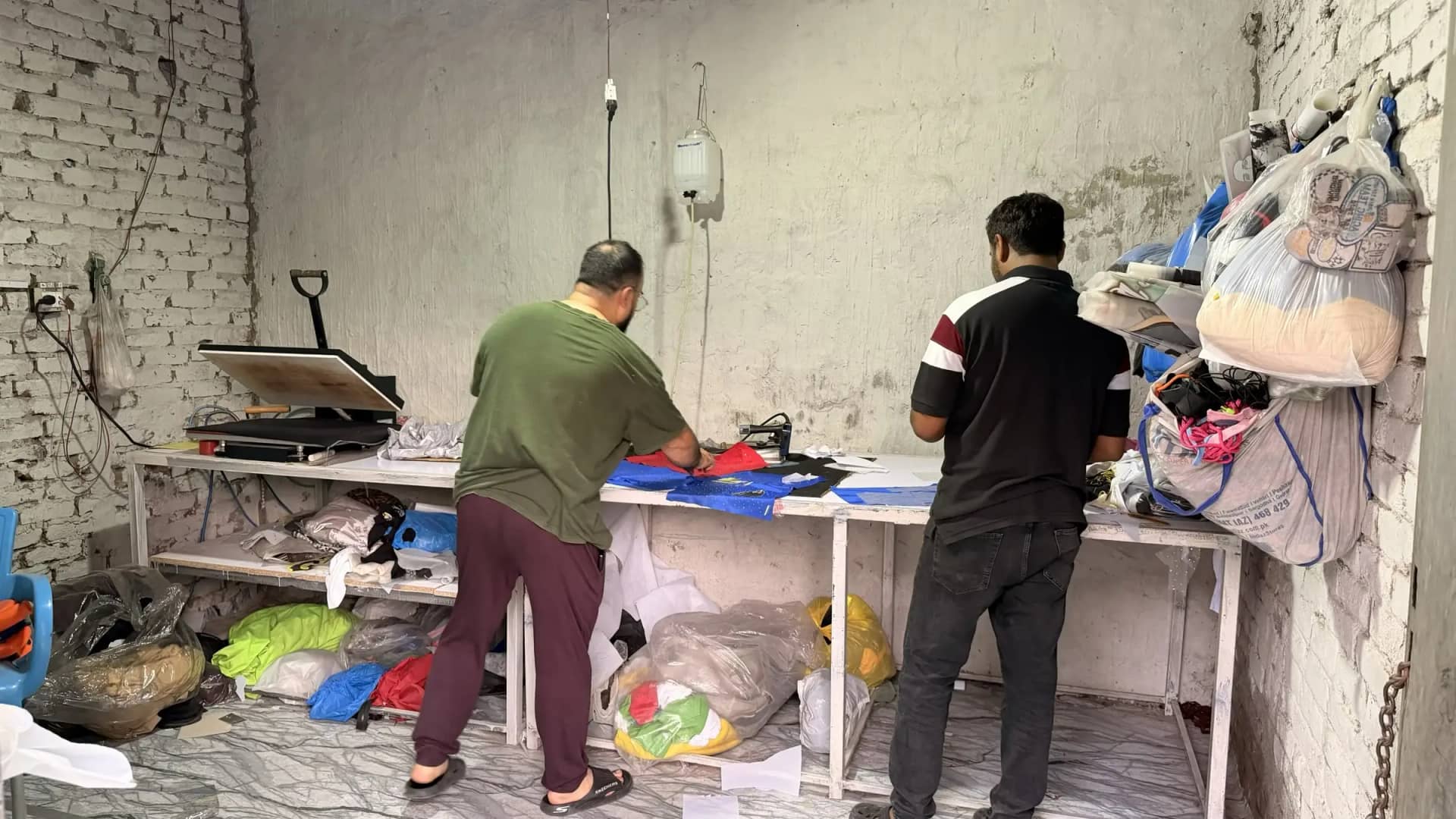 Pressing and steaming finished apparel before packaging — Mughal Apparel