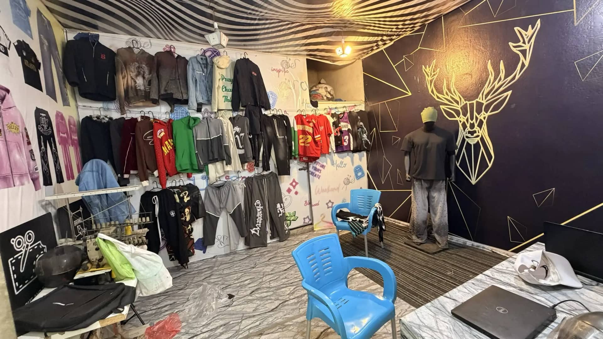 Custom streetwear hoodie display inside Mughal Apparel buyer showroom — Sialkot Pakistan