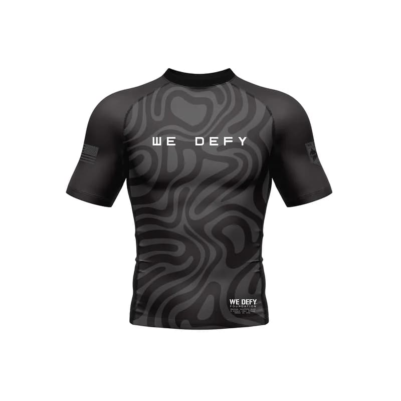 We Defy Jersey Short Sleeve Rashguard Black — image 1 of 1